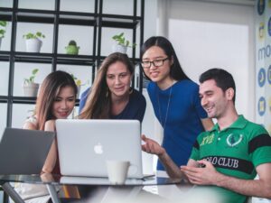 A group looking at a laptop